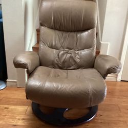 Swivel Rocking Chair Leather.( Brown.)  Dimensions are.  39” H— 35”W—-23”D.