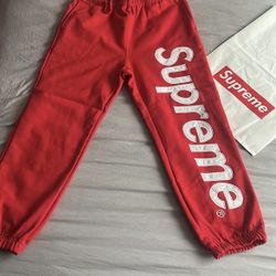 red and white supreme joggers size medium