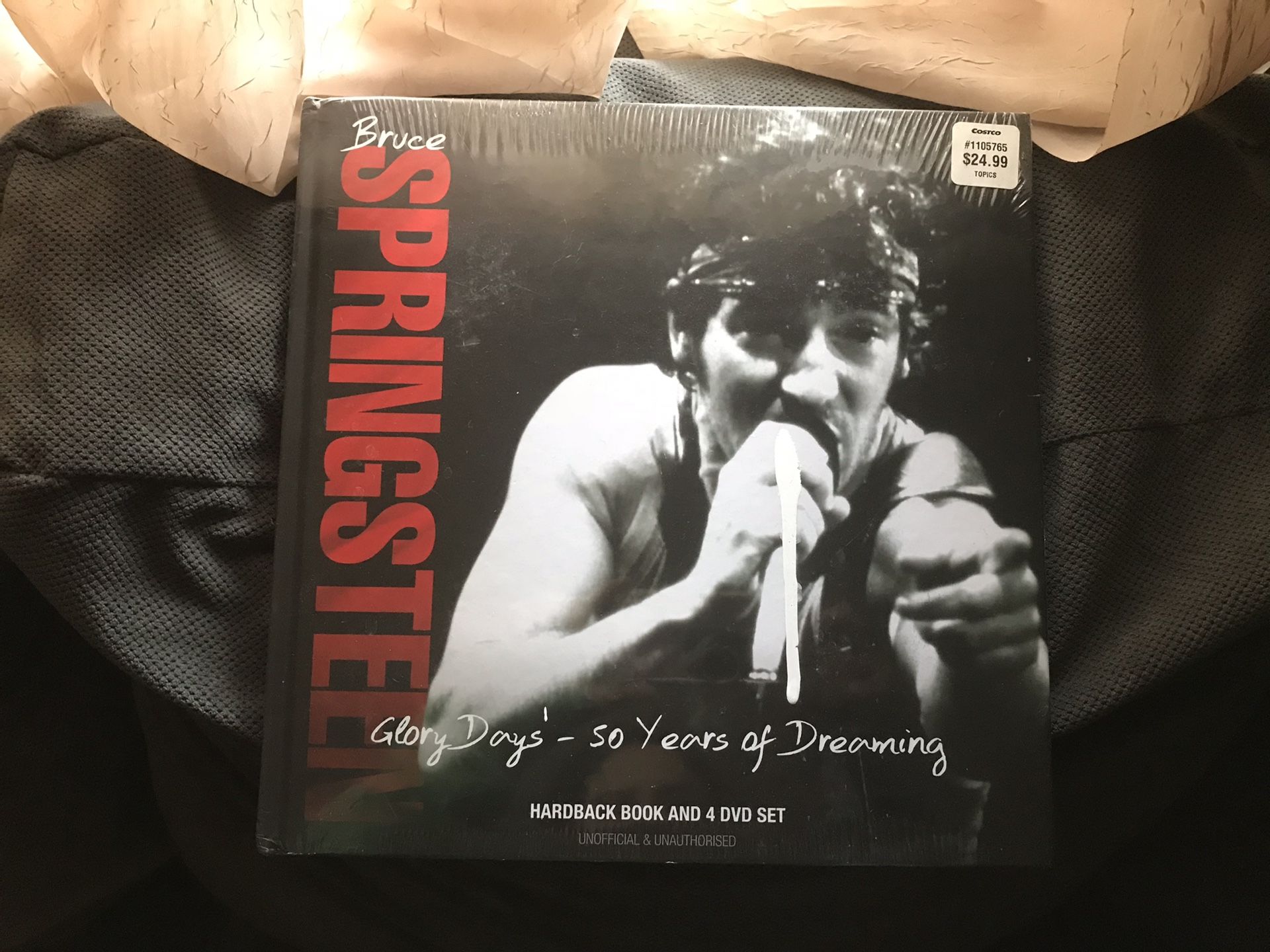 A Bruce Springsteen hardback book in for DVD set