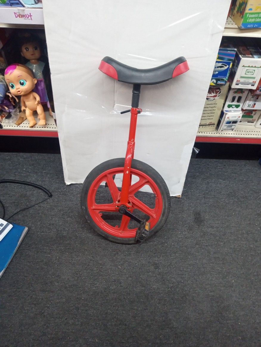 Red unicycle ready to ride
