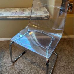 (2) clear IKEA dining  chairs with chrome frame -$125