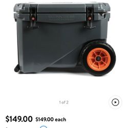 Lot of six pieces of camping equipment by Coleman and Ozark Trail. Includes $150 rolling cooler 2 chairs Table , A Cot,  camping cart All collapsible