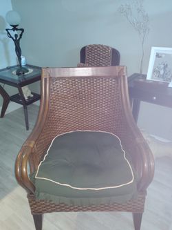 Square top rattan chair includes upholstered pad