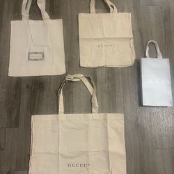 3 Gucci Tote bags  1 Silver Gift Bag