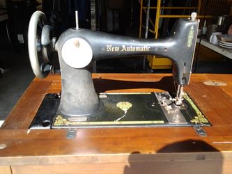 new automatic, console treadal sewing machine