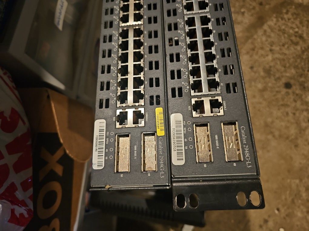 Two Cisco Catalyst 2948G-L3 Switches
