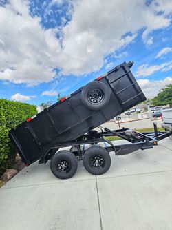 NEW DUMP TRAILER 12x8x4 12000 LBS
ROLLING TARP--SPARE TIRE,ELECTRIC BRAKES,HYDRAULIC SYSTEM,REMOTE CONTROL,IDEAL FOR HAULING, DEMOLITION, TRASH ETC,