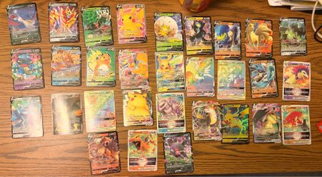 collection of various Pokémon Trading Card Game cards, featuring multiple V, VMAX, and GX cards.