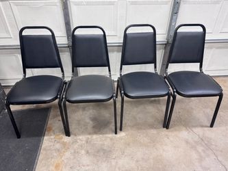 Set of 4 vinyl pad chairs. Stackable.