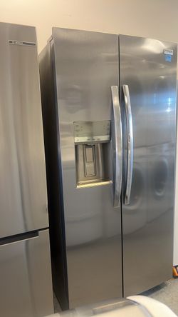 new refrigerator with scuffs and dents