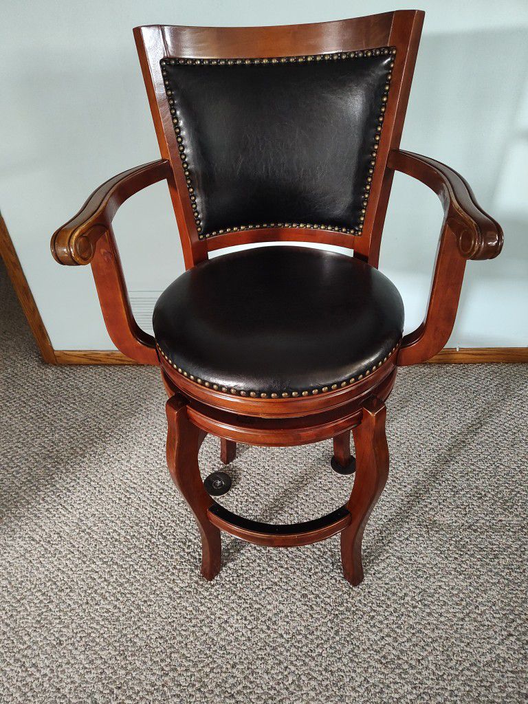 Beautiful captains chair for bar area and 5 matching stools to be sold separately.