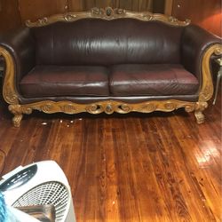 Nice leather burgundy sofa intact and clean.