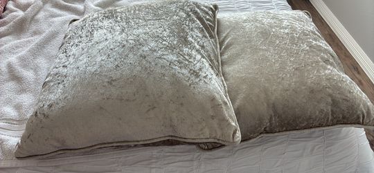 Two green velvet pillows