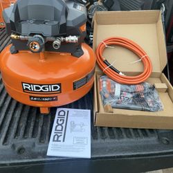  RIDGID 6 Gal. 150 PSI Portable Electric Oil-Free Jobsite Pancake Air Compressor with 25 ft. Air Hose and 18GA Brad Nailer