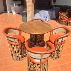 Equipales bar stools and high table