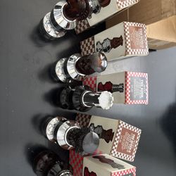 5 vintage Avon "Smart Move" collection aftershave decanters in the shape of various chess pieces.