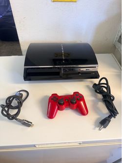 PlayStation 3 fat backwards compatible with some games installed $220 ( back has some cracks )