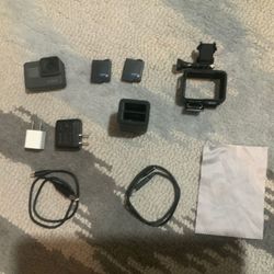 GoPro hero 5 black + extra battery and dual charger.