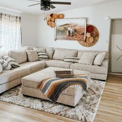 3-piece corner sectional or L-shaped sectional sofa and a ottoman