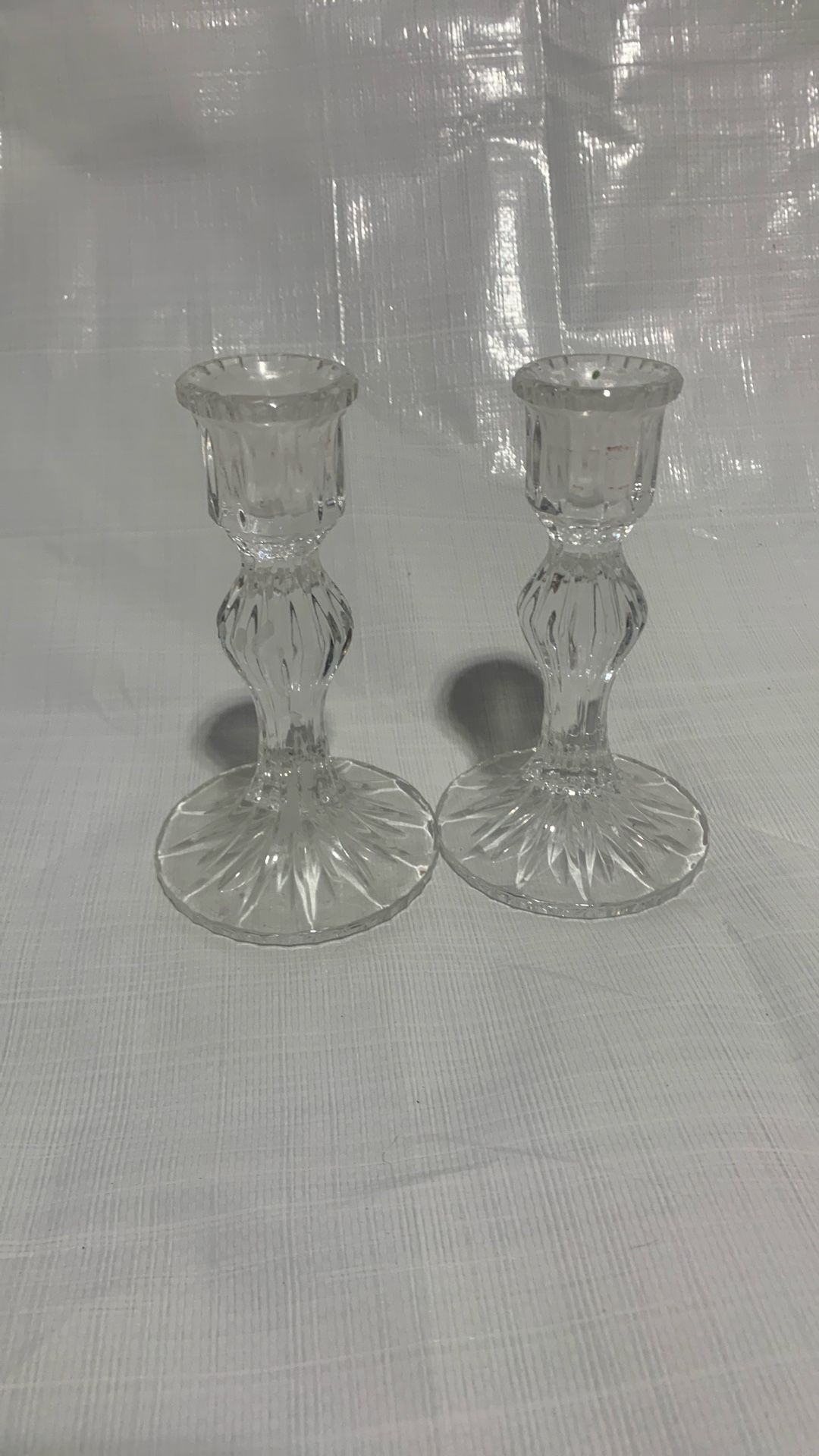 A pair of glass candle holders