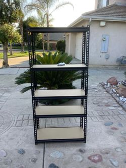Fresno - 5 tier shelving unit - new- $30 firm price - easy car transport