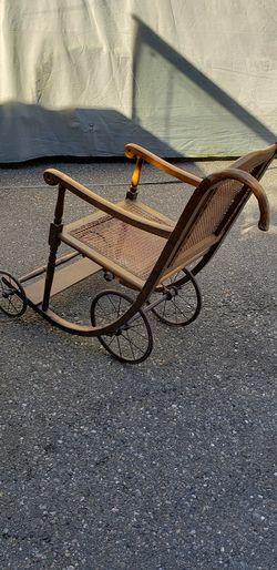 Rare antique wheel chair curved wood woven wicker 4 wheel spoke wheels hard rubber tires metal spokes