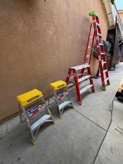 4 new ladders  8 ft $200-/3 ft orange $180 and 2- yellow 2 ft asking $50 each