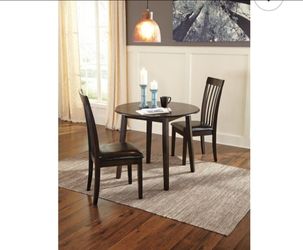 Round drop leaf dining table and 2 chairs