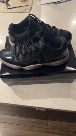 Air Jordan 11 Low Black Patent Leather Sneakers