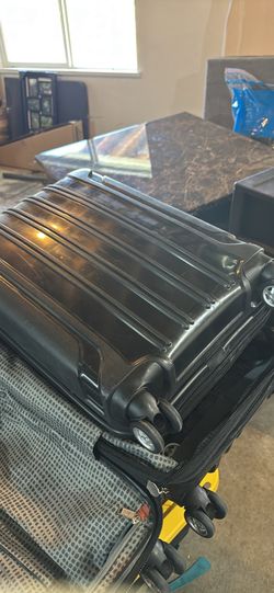 2 hard cased black suitcases