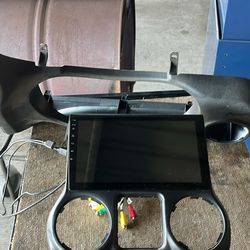 Android touchscreen car stereo head unit designed for a 2011-2017 Jeep Wrangler