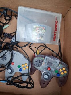 Nintendo gamecube w/ 2 controllers, memory card,  and DDRMM, and 2 Nintendo 64 controllers and Mario kart 64