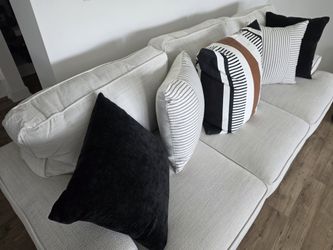 Cream/Light Gray Three-Cushion Sofa with Decorative Pillows