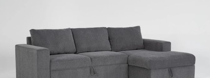 Light gray selectional electric couch they have drawers to place things in keep organized