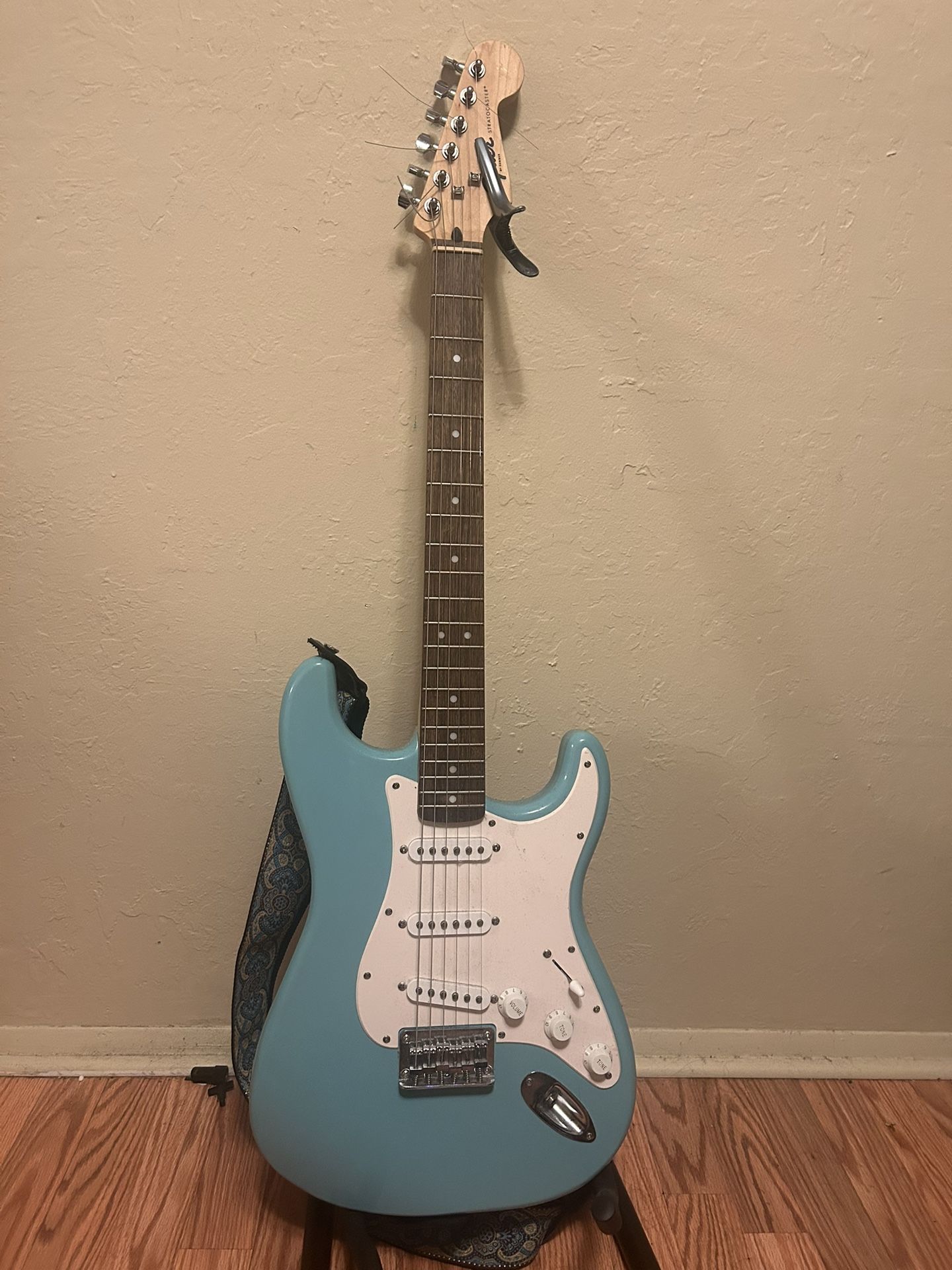 Squier Electric Guitar with Capo and Guitar Strap