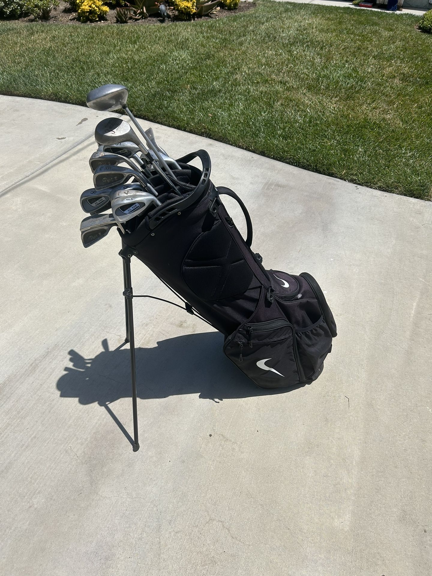 Nike Golf Bag and Multiple Clubs