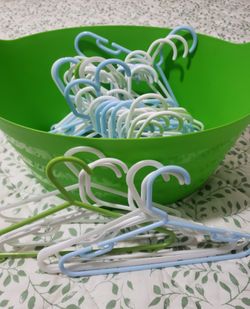 Children's Plastic Clothes Hangers (50) In White, Blue, & Green In Bright Green Plastic Storage Basket!