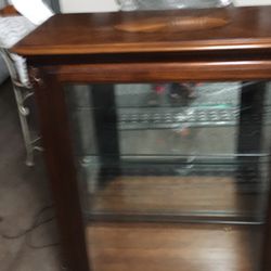 Curio Cabinet 34 1/2 W X 17 D X 44 1/2 H  No Phone Number 