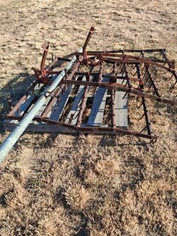 Adjustable drag harrow