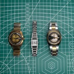 3 Watch Combo - 2 Timex Q Day-Date Men's Quartz Watches, 1 Bulova Ladies ref. C833104
