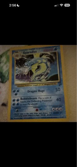 Gyarados Pokémon base set holo card and Japanese variant of N’s Zekrom and Charizard EX holo rare