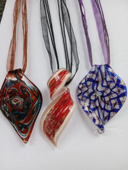 Three new glass pendant necklaces on strings