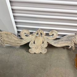 Rococo-style decorative element made of thin metal.