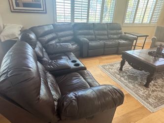 3 piece reclining sectional, brown with real leather.