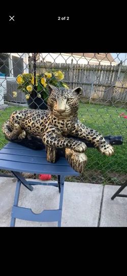 Golden Leopard On The Log Statue