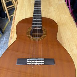 Acoustic guitar with  sound control buttons