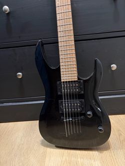 Mitchell black electric guitar