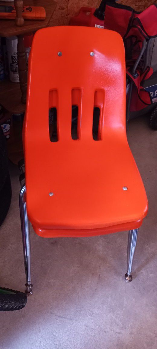 2 Orange Kids Chairs, Will Hold Adults As I've Sat In Them.