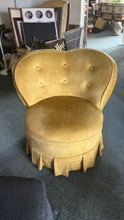 Vintage yellow stuffed chair.