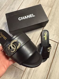Black Chanel leather slides